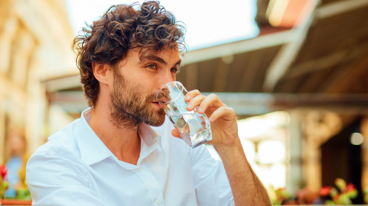 Feature | man drinking water | Why You Should Manage Your Fluid Intake To Treat Constipation | liquid intake